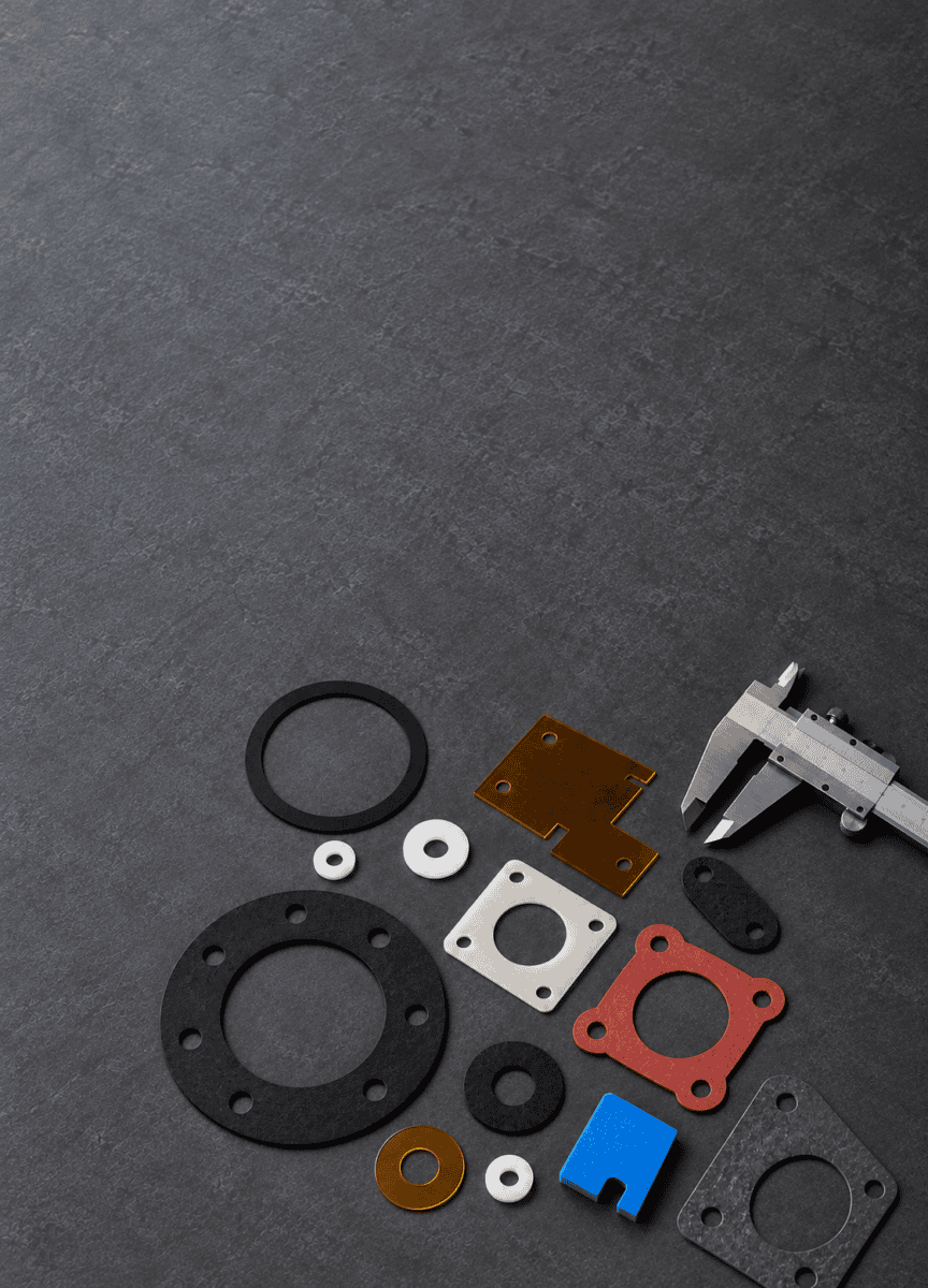 Assorted gaskets, insulators and components laid out with precision calipers